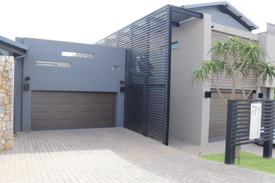 Garage door Chromadeck steel single bronze slat W2440mm x H2135mm