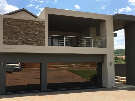 Garage door single frameless glass bronze