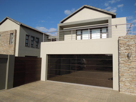 Garage door double frameless glass bronze